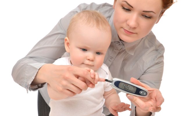 measuring glucose level blood test from diabetes child baby